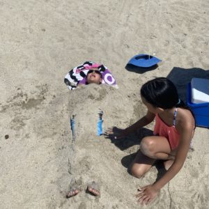the kids enjoying their time at the beach